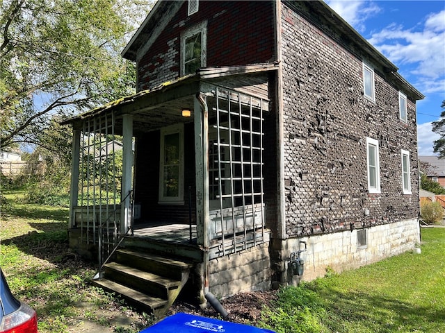 view of home's exterior featuring a yard