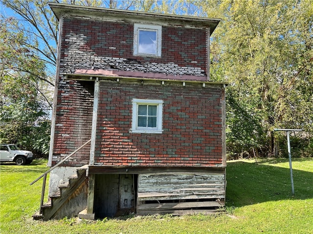 view of side of property with a yard