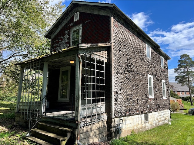 view of home's exterior with a lawn