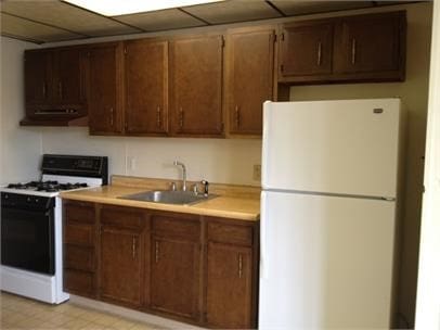 kitchen with white appliances and sink