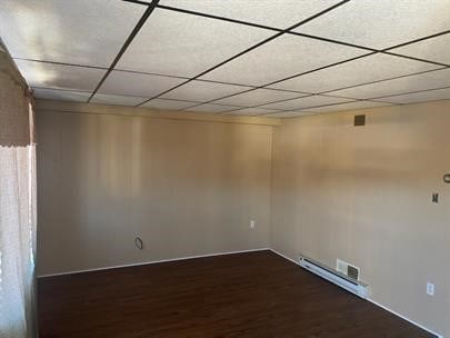 spare room with dark wood-type flooring