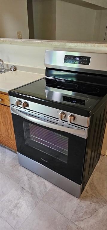 kitchen featuring stainless steel electric range