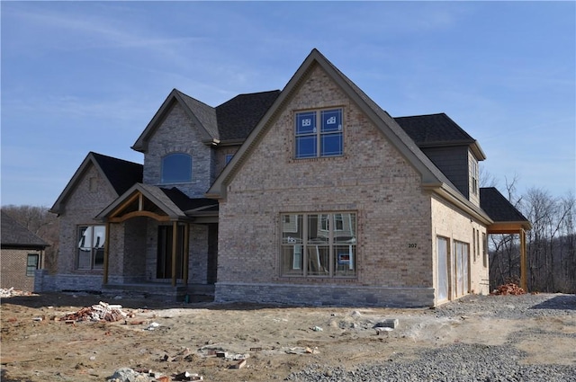 207 Falcon Ln, Cranberry Twp, PA 16066 - view of front of home with a porch, brick siding, and a garage