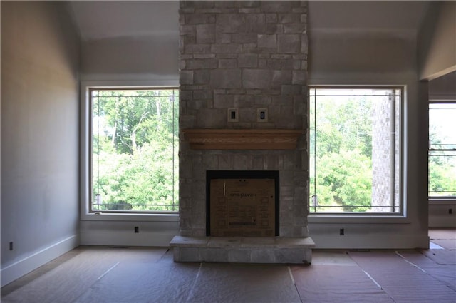 207 Falcon Ln, Cranberry Twp, PA 16066 - unfurnished living room featuring a fireplace and baseboards