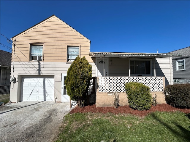 view of front of property with cooling unit and a garage