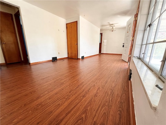 empty room featuring wood-type flooring and ceiling fan