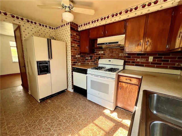 kitchen with white appliances, ceiling fan, and sink