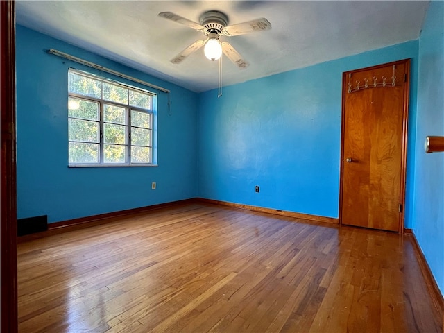 spare room with ceiling fan and light hardwood / wood-style flooring