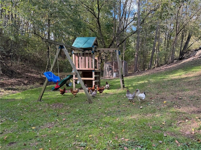 view of playground featuring a lawn