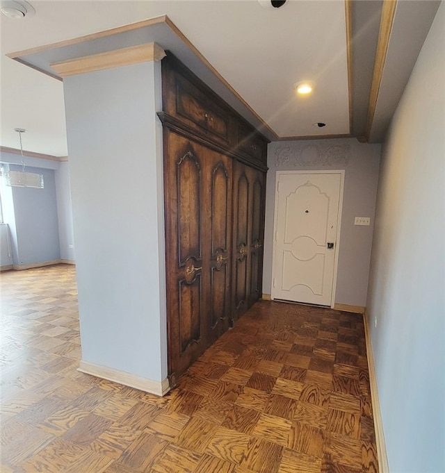 corridor featuring ornamental molding