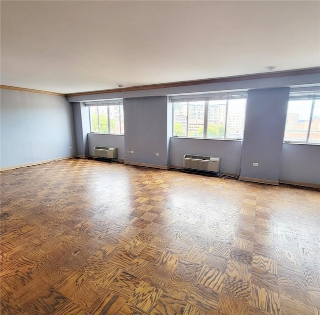 128 N Craig St Unit 703, Oakland, PA 15213 - unfurnished room featuring crown molding, a wall mounted AC, an AC wall unit, and a wealth of natural light