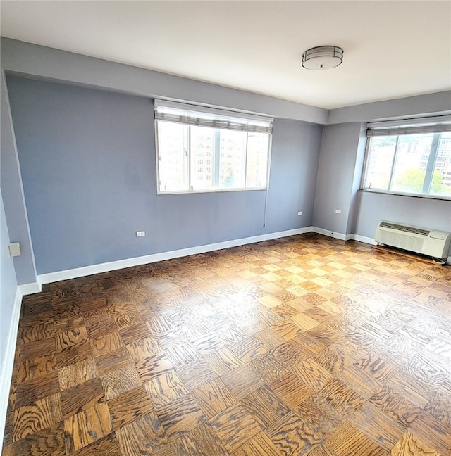 spare room featuring a wall mounted AC