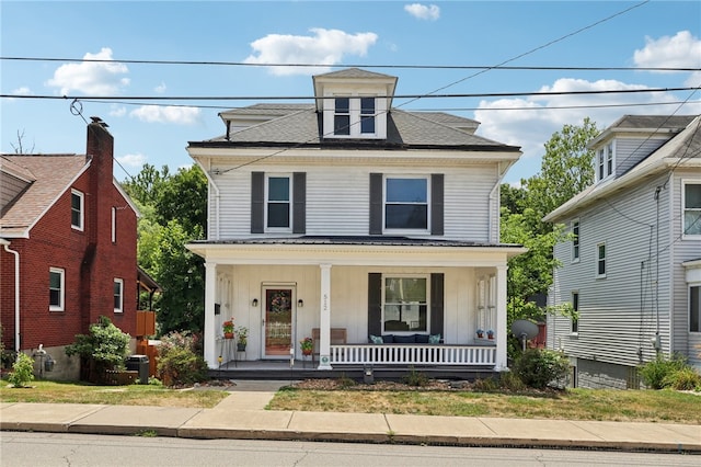 view of front of home with cooling unit and a porch