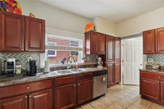 kitchen with decorative backsplash, dishwasher, light tile patterned floors, and sink