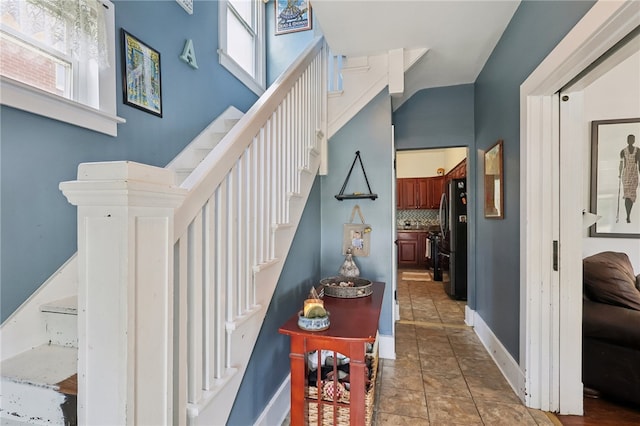 stairs with tile patterned floors