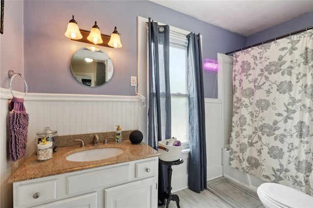 full bathroom with shower / tub combo, vanity, and toilet