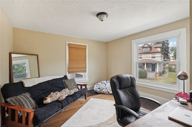 office area with hardwood / wood-style flooring