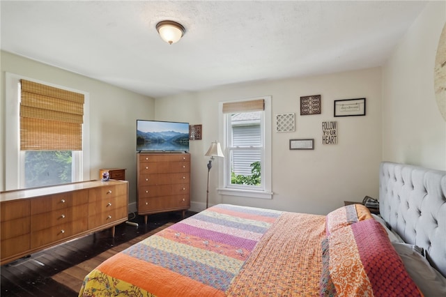 bedroom featuring dark hardwood / wood-style flooring