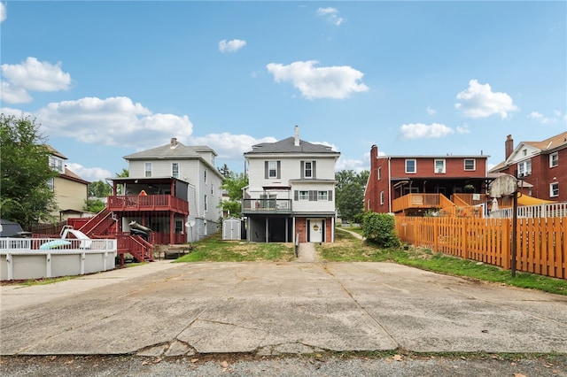 exterior space with a balcony and a deck