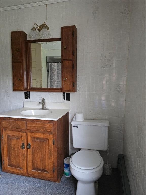 bathroom featuring vanity, tile walls, and toilet