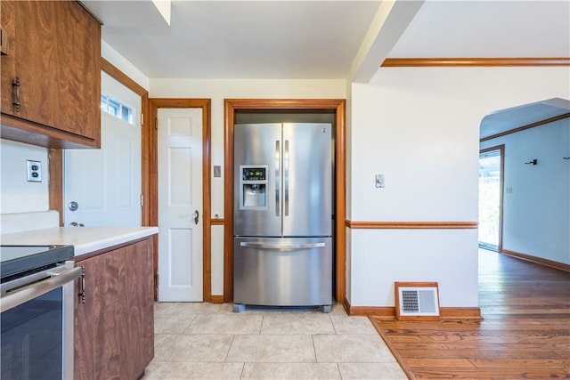 kitchen with stainless steel appliances and light hardwood / wood-style floors