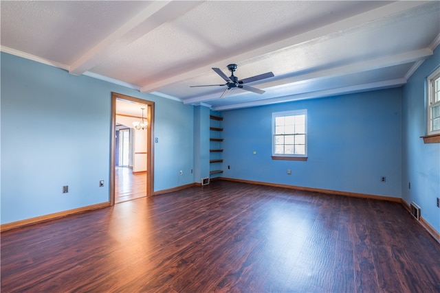 empty room featuring ornamental molding, ceiling fan with notable chandelier, a textured ceiling, dark wood-type flooring, and beam ceiling