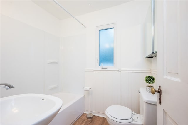 full bathroom with sink, shower / bathing tub combination, hardwood / wood-style floors, and toilet