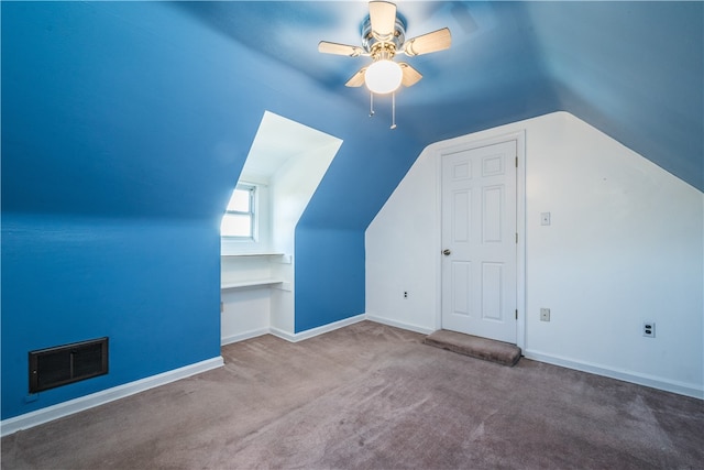 bonus room with carpet floors, vaulted ceiling, and ceiling fan