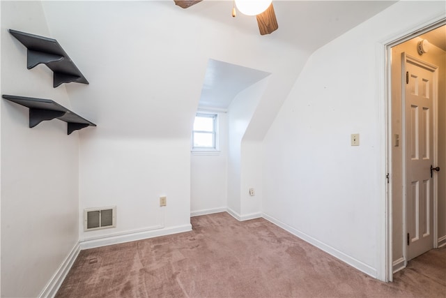 bonus room featuring ceiling fan, light colored carpet, and lofted ceiling