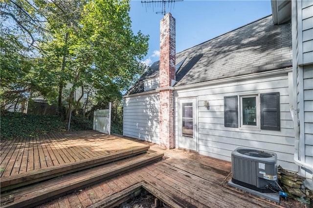 wooden deck featuring central AC unit