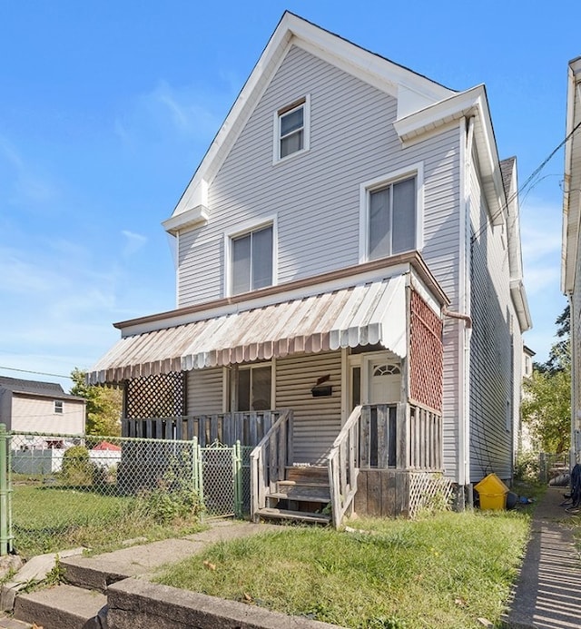 view of front of home featuring a porch and a front lawn