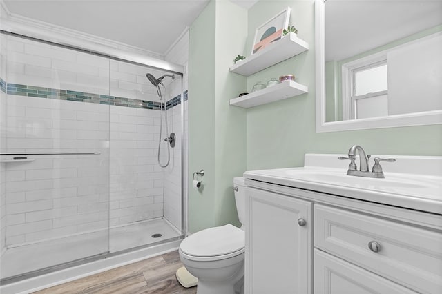 bathroom with vanity, walk in shower, hardwood / wood-style floors, and toilet