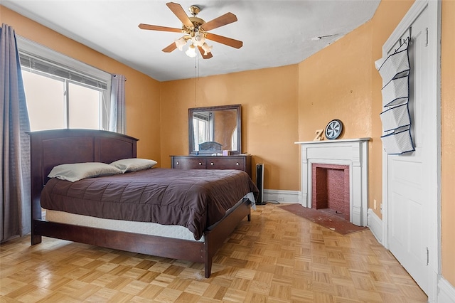 bedroom featuring ceiling fan and light parquet flooring