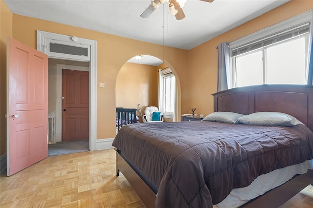 bedroom featuring ceiling fan and light parquet flooring