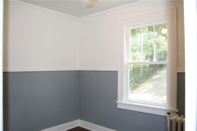 spare room featuring radiator