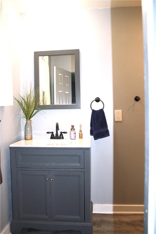 bathroom featuring vanity and hardwood / wood-style floors