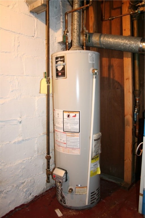 utility room with gas water heater