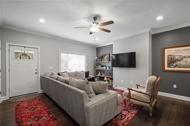 living room featuring dark hardwood / wood-style floors, ceiling fan, and ornamental molding