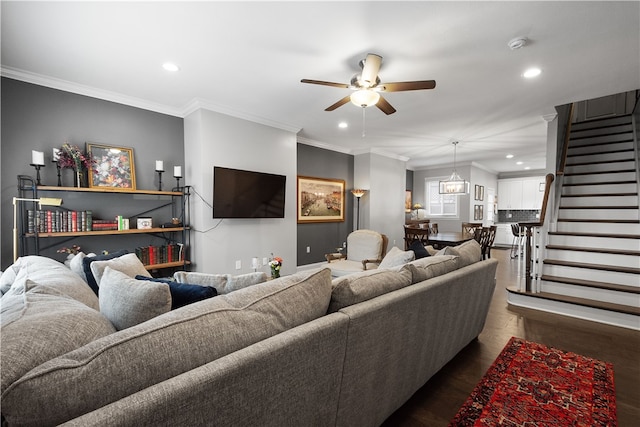 living room with ceiling fan, dark wood-type flooring, and ornamental molding