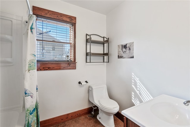 bathroom featuring toilet and vanity