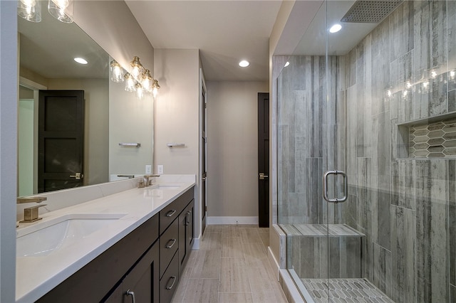 bathroom with walk in shower and vanity