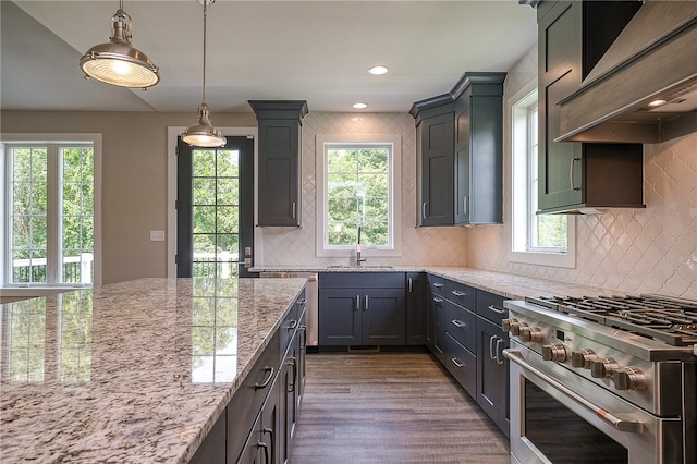 kitchen with pendant lighting, dark hardwood / wood-style flooring, stainless steel stove, and tasteful backsplash