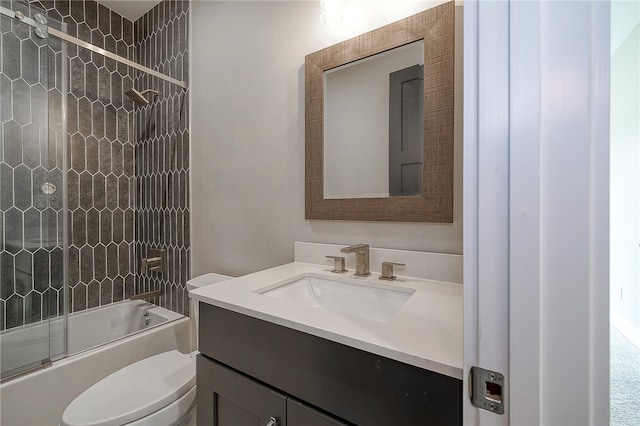 full bathroom with shower / bath combination with glass door, vanity, and toilet