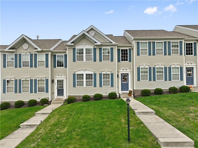 view of property featuring a front yard