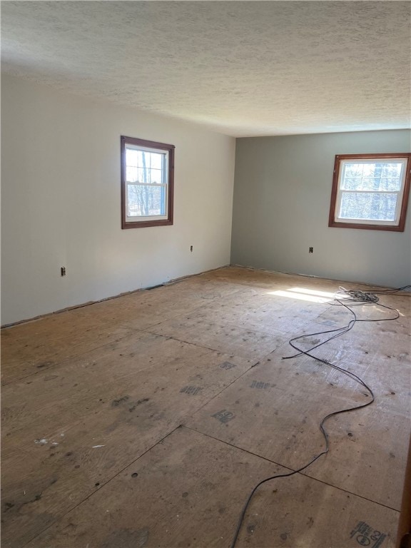 spare room featuring a textured ceiling