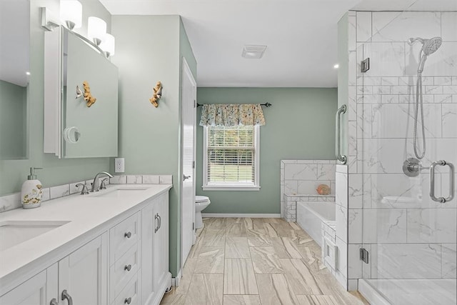 full bathroom featuring vanity, separate shower and tub, and toilet