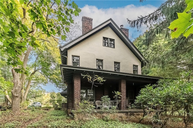 rear view of house with a porch