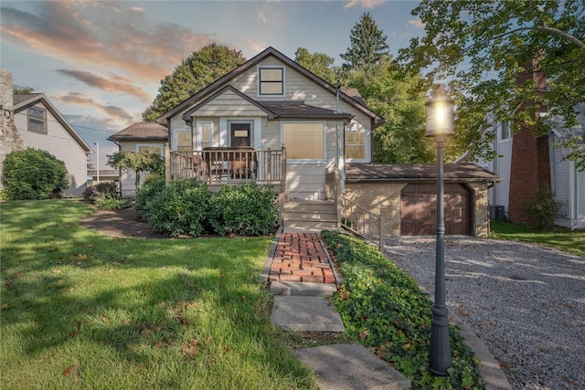 bungalow-style home with a yard