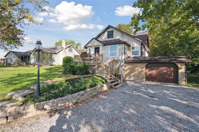 view of front of home with a garage and a front yard