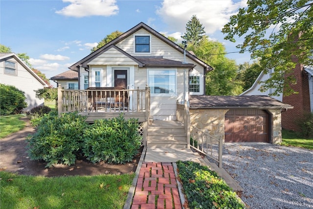 bungalow-style house with a wooden deck